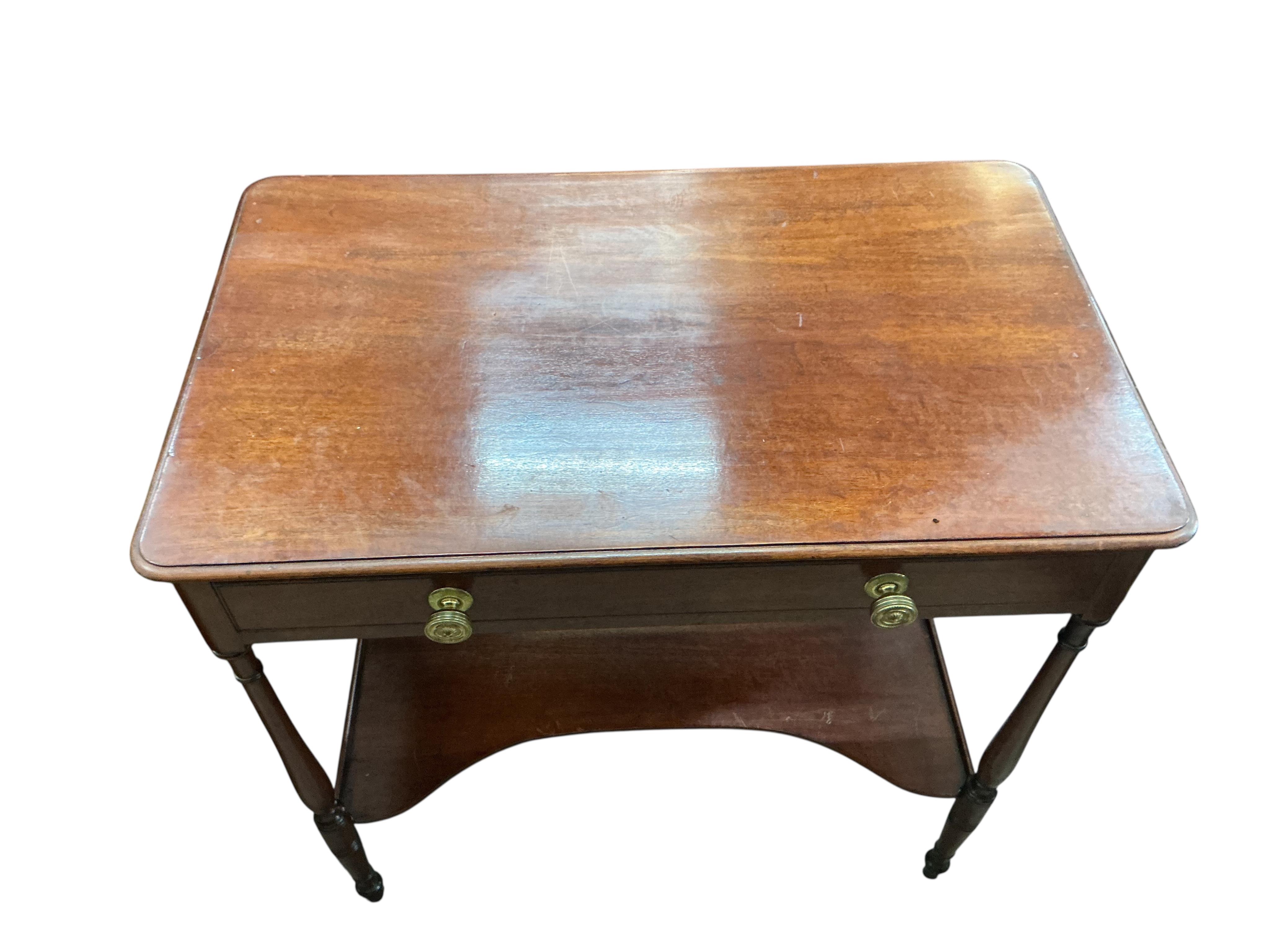 A small Victorian mahogany dressing table, with slender ring turned legs and undertier, width 74cm, depth 45cm, height 75cm